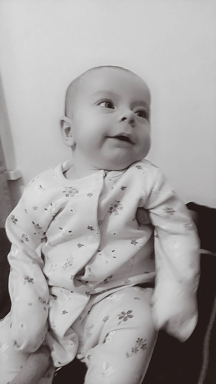 Emma-rose is registered to the contest to win money with this photo: baby, baby_toddler_clothing, cheek, chin, collar, comfort, dress_shirt, eye, flash_photography, grey, happy, head, human_body, iris, lip, mouth, nose, person, sleeve, smile