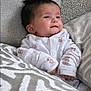 baby, infant, smiling, onesie, teddy_bear, blanket, cushion, gray, white, soft, cozy, indoor, portrait, child, cute, happy, resting, face, person, newborn