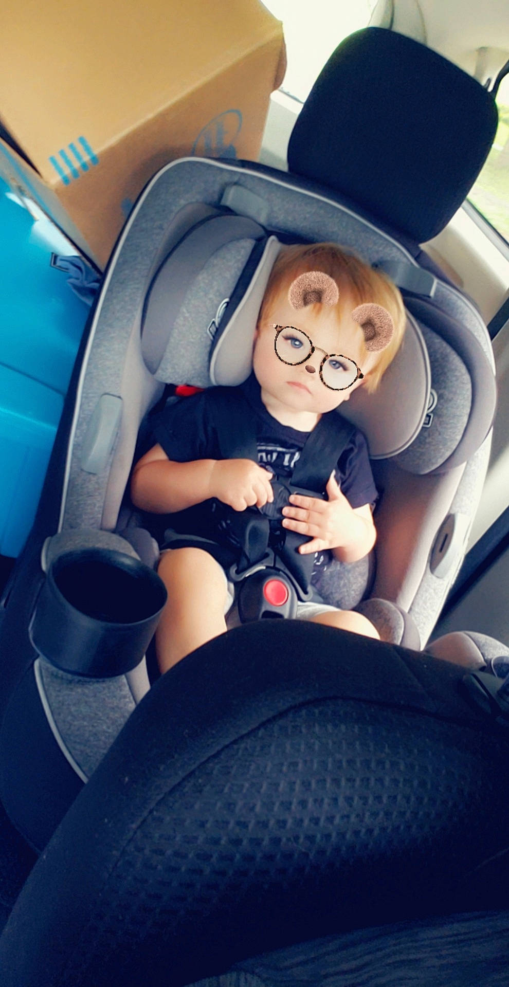Lawrence is registered to the contest to win money with this photo: auto_part, baby_in_car_seat, car, car_seat, child, cool, driving, family_car, fictional_character, fun, head_restraint, person, seat_belt, selfie, sitting, smile, steering_wheel, toddler, vacation, vehicle