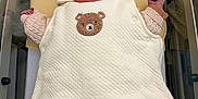 Andréa a rejoint le concours — aidez-le/la à gagner de superbes lots ! newborn, baby, sleeping, bassinet, hospital, blanket, white, hat, cute, teddy_bear, clothing, infant, peaceful, resting, swaddled, pink_sweater, soft, indoors, person, newborn_baby