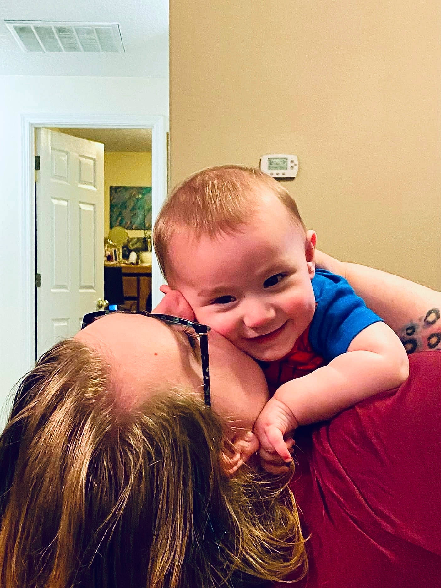 Marcus is registered to the contest to win money with this photo: child, comfort, eyewear, flash_photography, flooring, fun, gesture, grass, happy, hug, human_body, joy, laugh, love, nose, person, portrait_photography, room, selfie, sitting