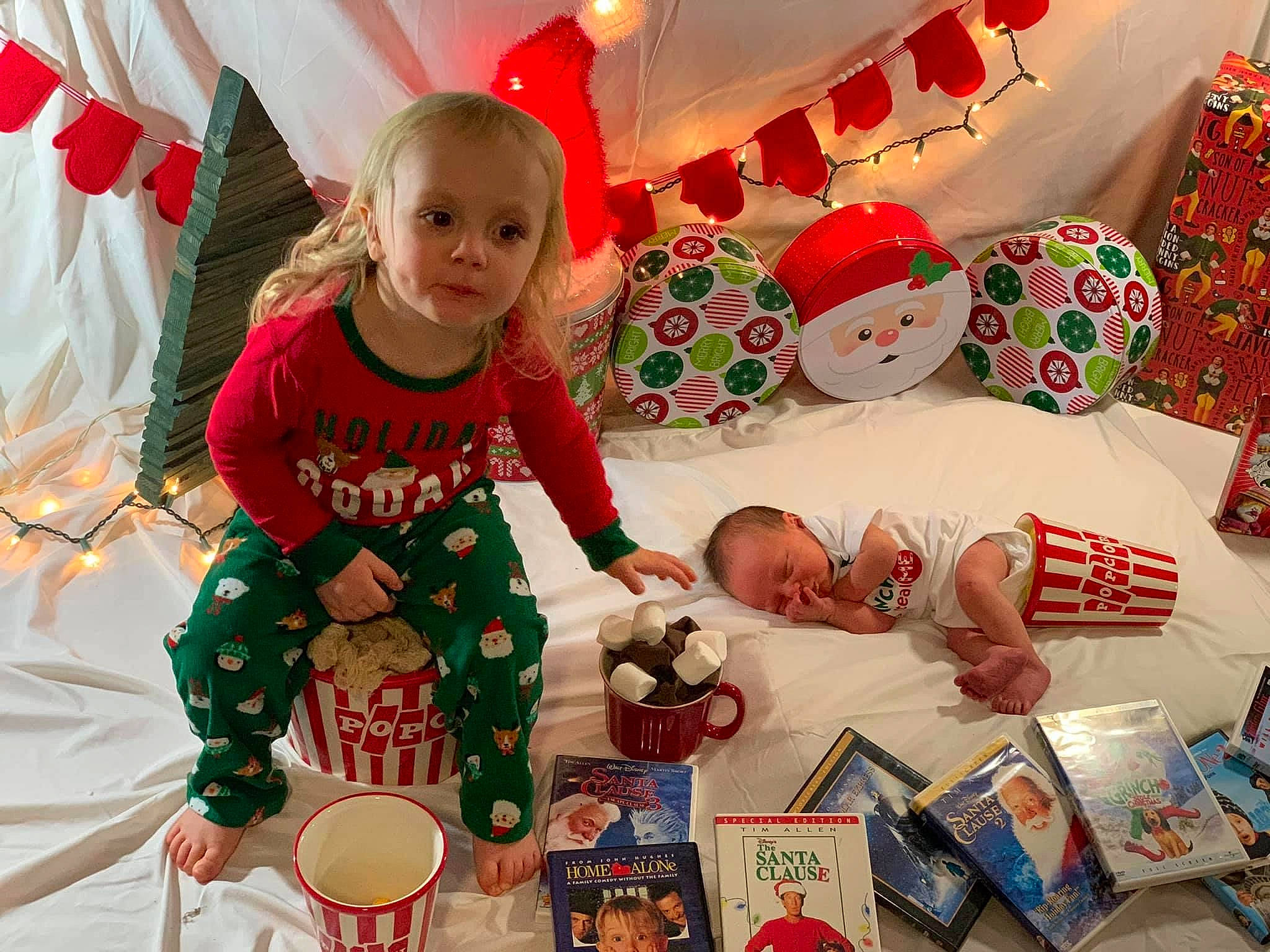 Channing is registered to the contest to win money with this photo: baby, baby_toddler_clothing, baby_toys, child, christmas, christmas_eve, coffee_cup, cup, holiday, human, interior_design, mug, ornament, party_supply, person, porcelain, serveware, teacup, toddler, toy
