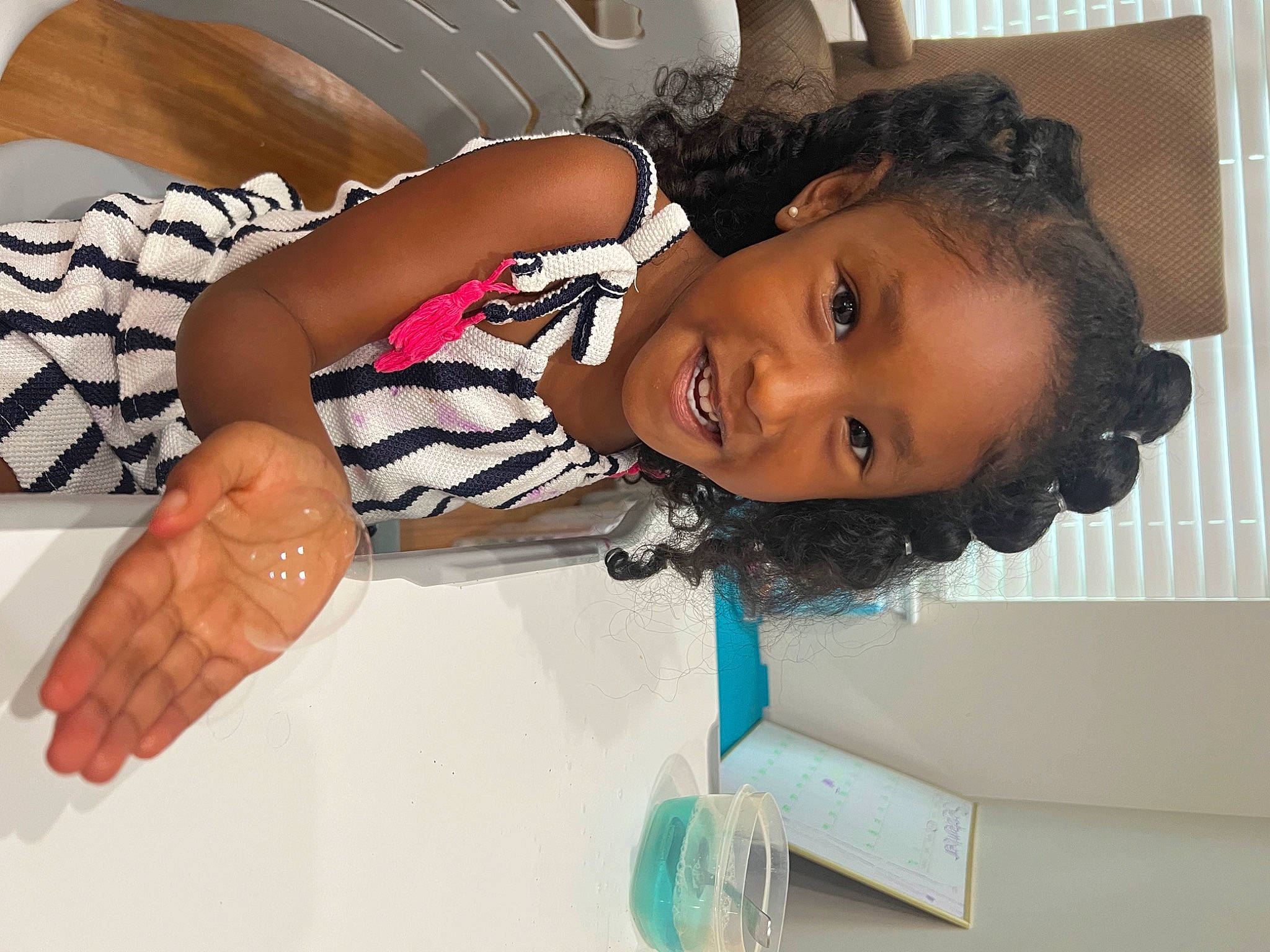 Zahra joined the competition — help win amazing prizes! black_hair, cheek, child, comfort, elbow, eyelash, fashion_design, fun, gesture, happy, joy, nail, person, room, sleeve, smile, thumb, toddler, wrist