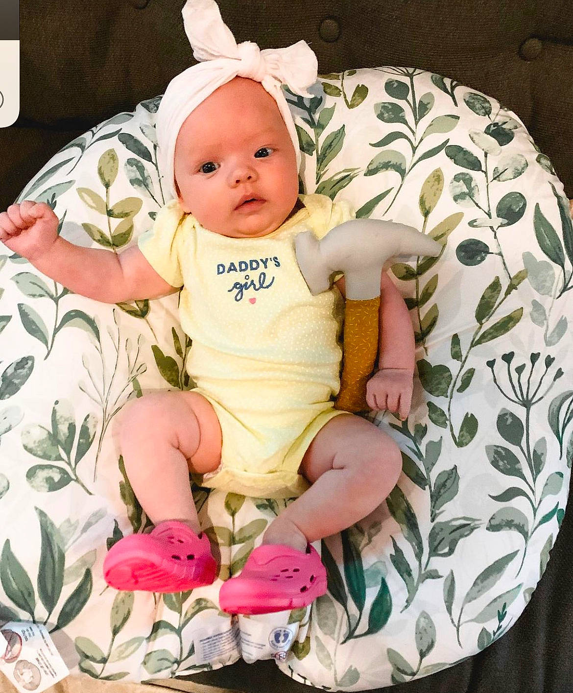 Penny is registered to the contest to win money with this photo: baby, baby_products, baby_safety, baby_toddler_clothing, cheek, child, comfort, eye, fashion_accessory, happy, head, headwear, iris, linens, pattern, person, pink, sitting, sleeve, sock