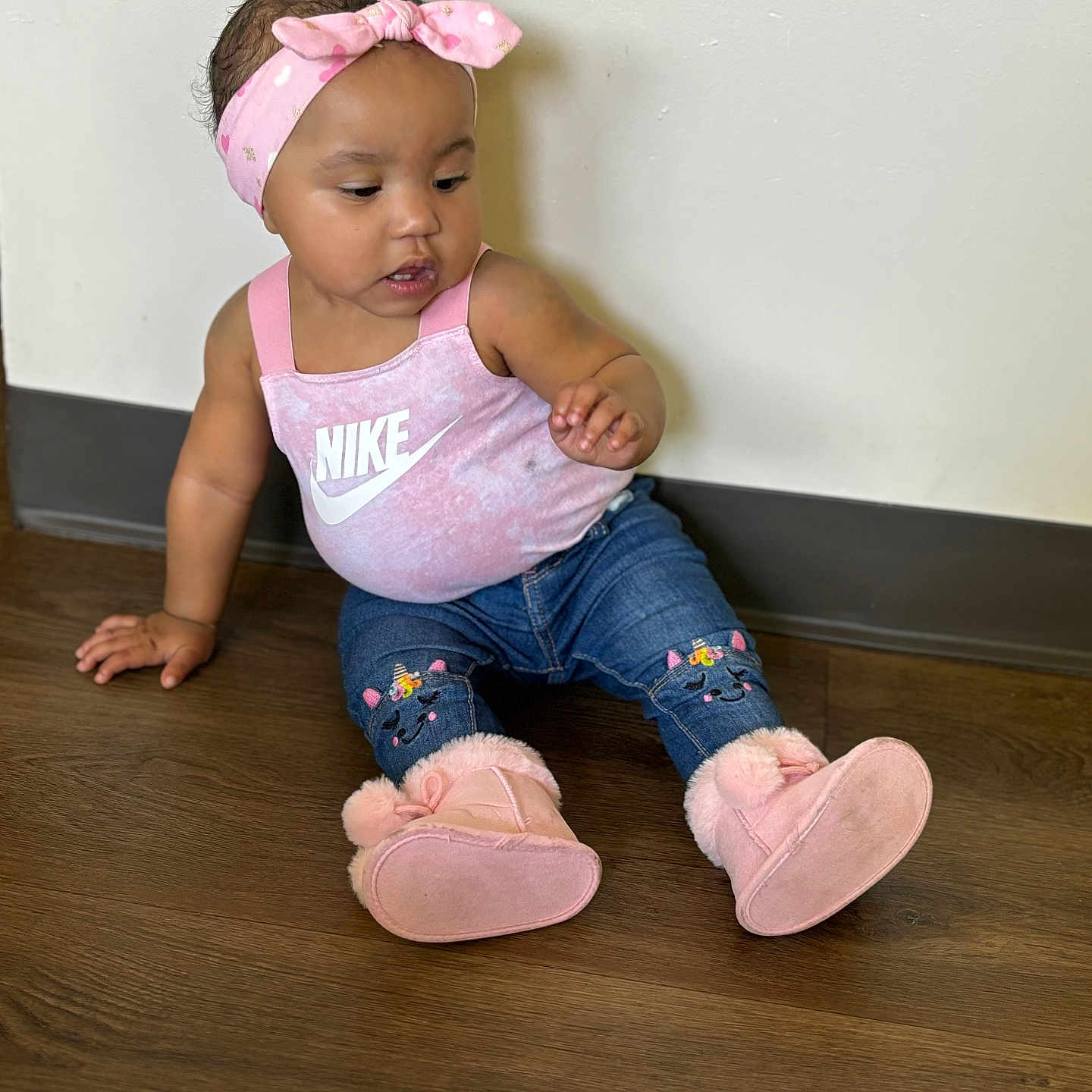 Dynasty is registered to the contest to win money with this photo: accessories, baby, bodypart, clothing, face, finger, footwear, hand, hardwood, hat, head, headband, jeans, pants, person, photography, portrait, shoe, sitting, wood