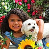 child, dog, flower, sunflower, rose, garden, smile, happy, curly_hair, pet, outdoor, greenery, nature, friendship, cute, plant, animal, summer, portrait, colorful