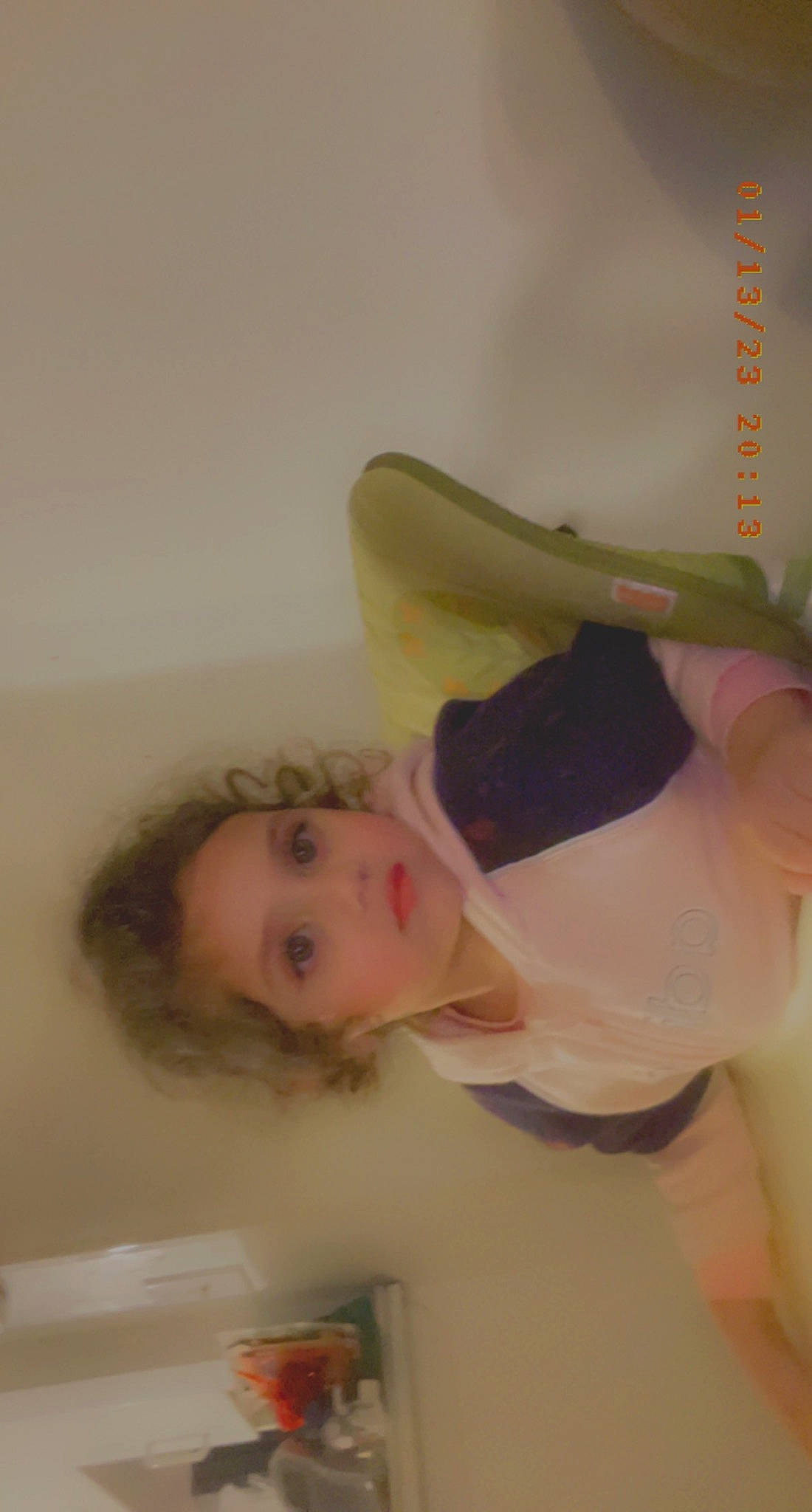 Ariana is registered to the contest to win money with this photo: child, comfort, flooring, foot, gesture, happy, human_leg, knee, person, room, toddler