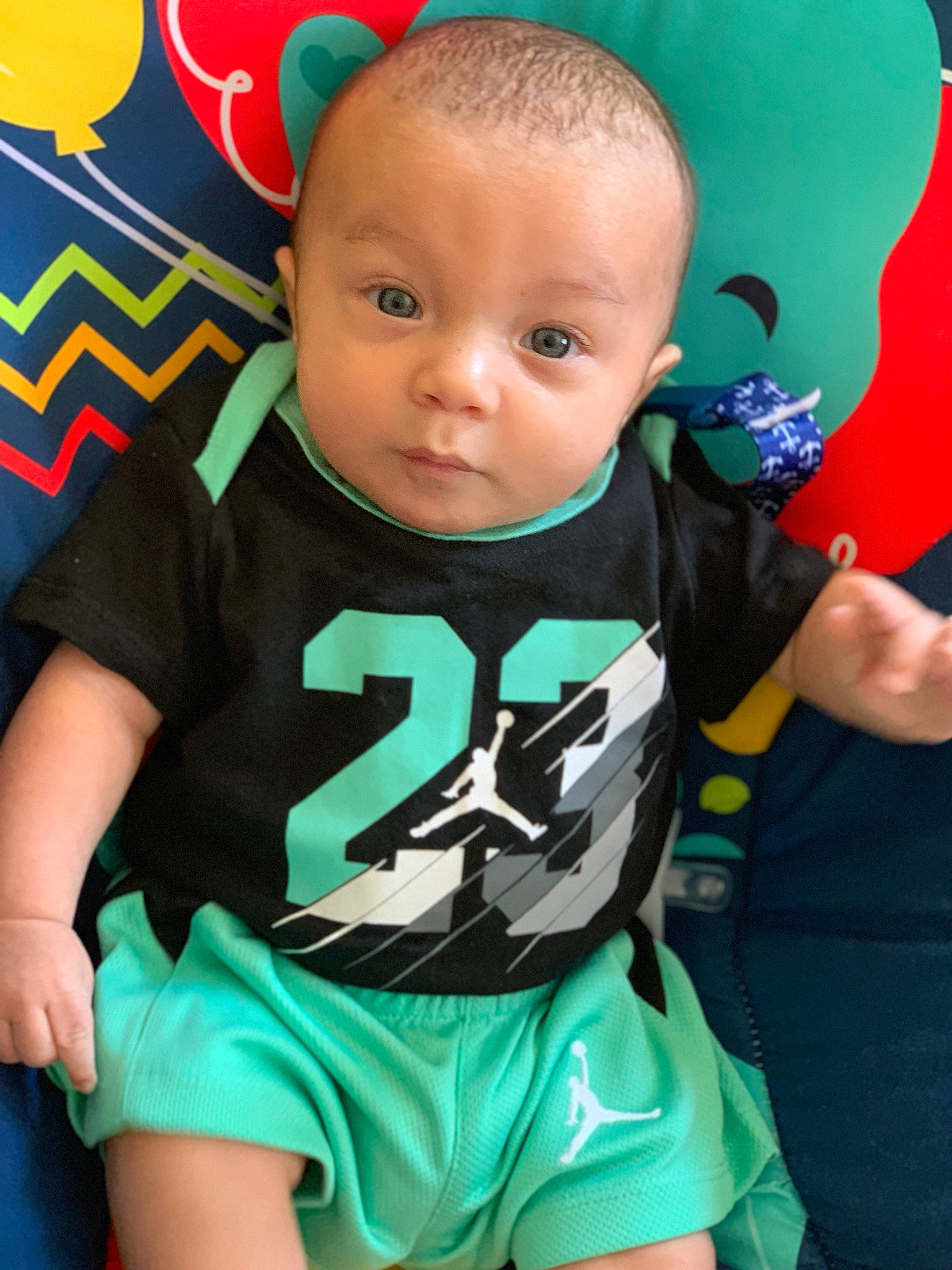 Jakobe is registered to the contest to win money with this photo: baby, baby_products, baby_toddler_clothing, child, cool, green, head, person, play, product, smile, t_shirt, toddler