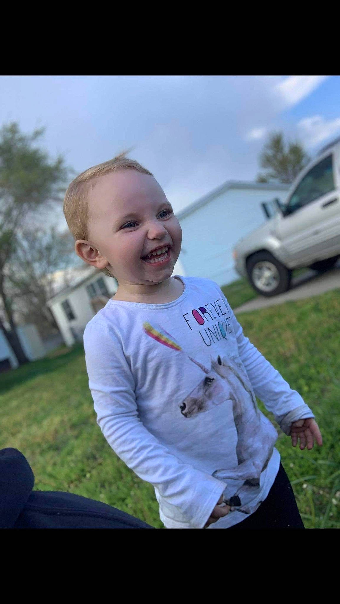 Roselynn is registered to the contest to win money with this photo: car, child, eye, facial_expression, family_car, fun, grass, happy, joy, laugh, person, photography, plant, smile, t_shirt, toddler, tree, vehicle