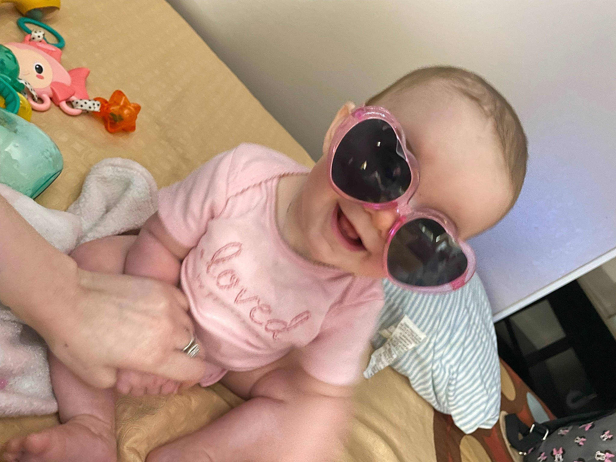Parklie is registered to the contest to win money with this photo: baby, baby_products, baby_toddler_clothing, chest, child, comfort, eyewear, fun, goggles, happy, nail, people, person, personal_protective_equipment, pink, product, room, skin, sunglasses, thumb