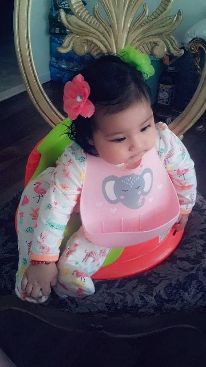 Kira is registered to the contest to win money with this photo: baby, beauty, cheek, child, hair_accessory, person, pink, play, sitting, skin, smile, toddler