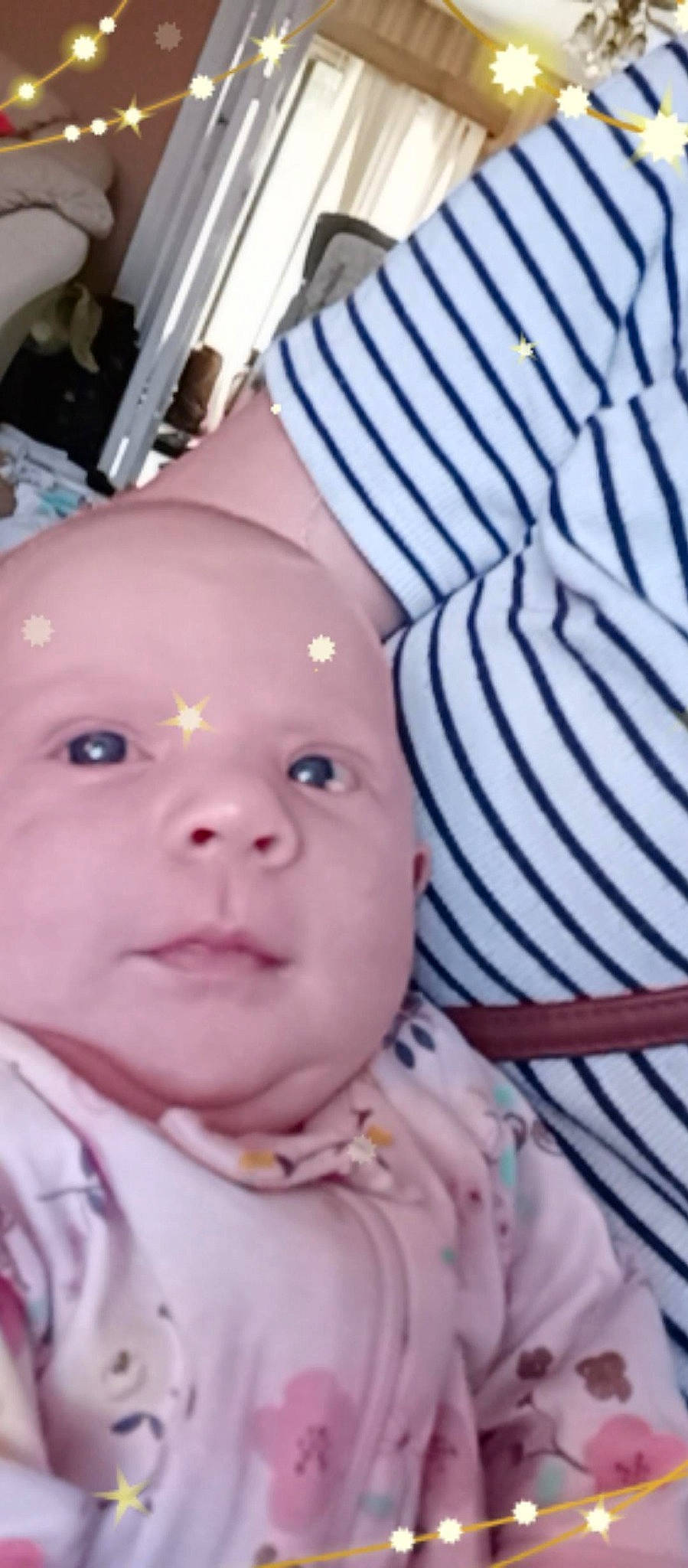 Laycie is registered to the contest to win money with this photo: baby, baby_products, baby_toddler_clothing, cheek, child, ear, eyelash, flesh, fun, happy, headwear, human_body, iris, lip, mouth, nose, pattern, person, pink, sitting