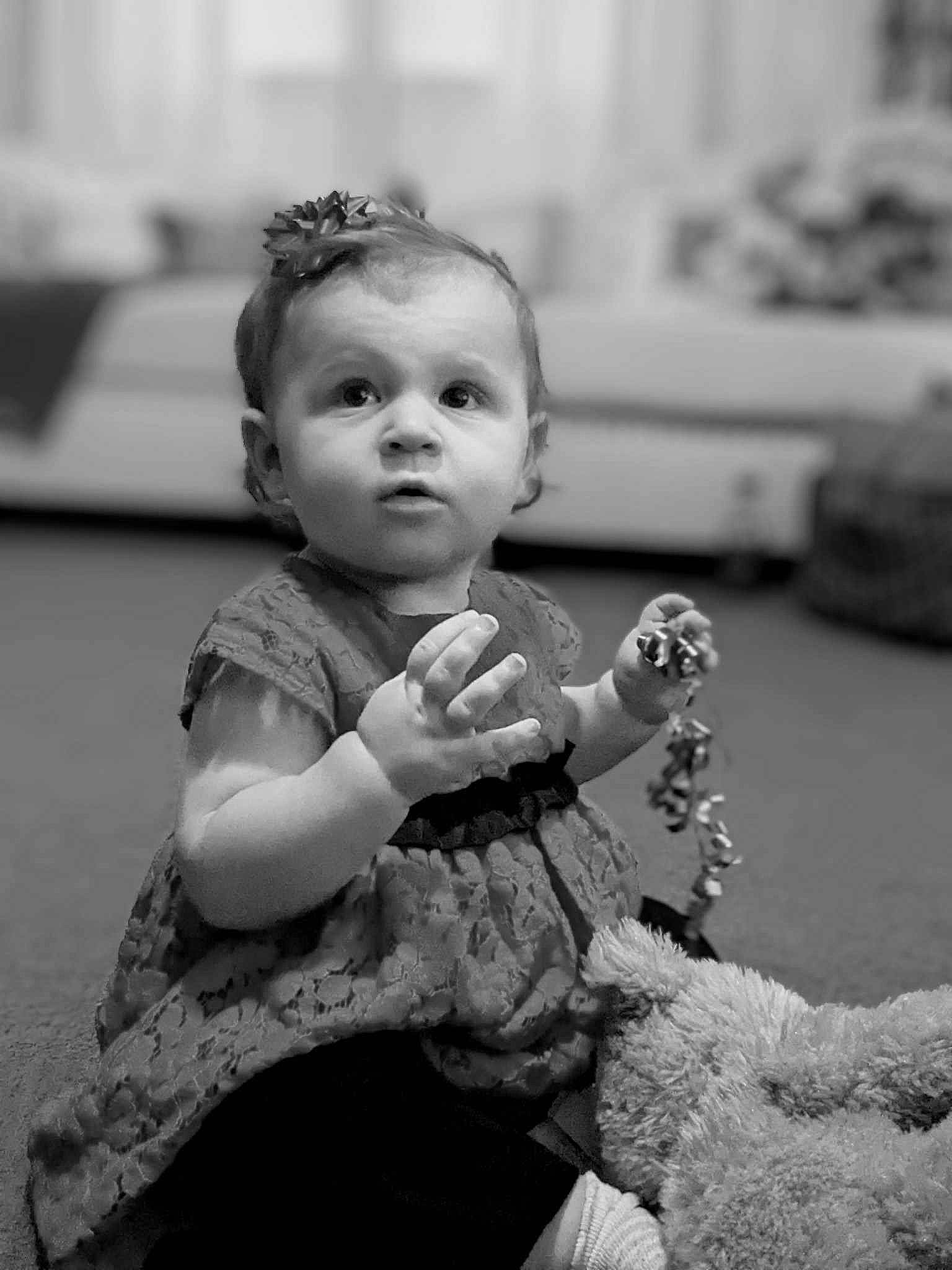 Aliyah is registered to the contest to win money with this photo: baby, black, black_and_white, child, flash_photography, fun, gesture, happy, monochrome, monochrome_photography, people, person, portrait_photography, road, sitting, standing, stock_photography, street, style, toddler