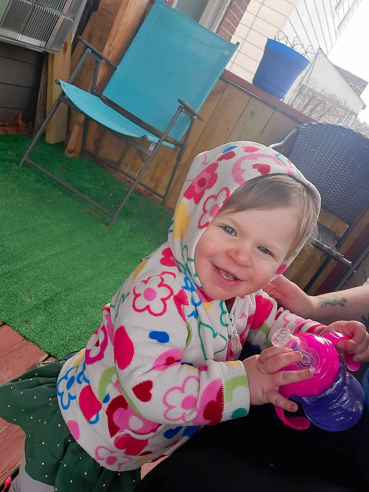 Aliyah joined the competition — help win amazing prizes! baby, baby_products, baby_toddler_clothing, baseball_cap, cap, comfort, fun, grass, happy, hat, joy, lap, leisure, magenta, person, pink, plant, recreation, sitting, smile