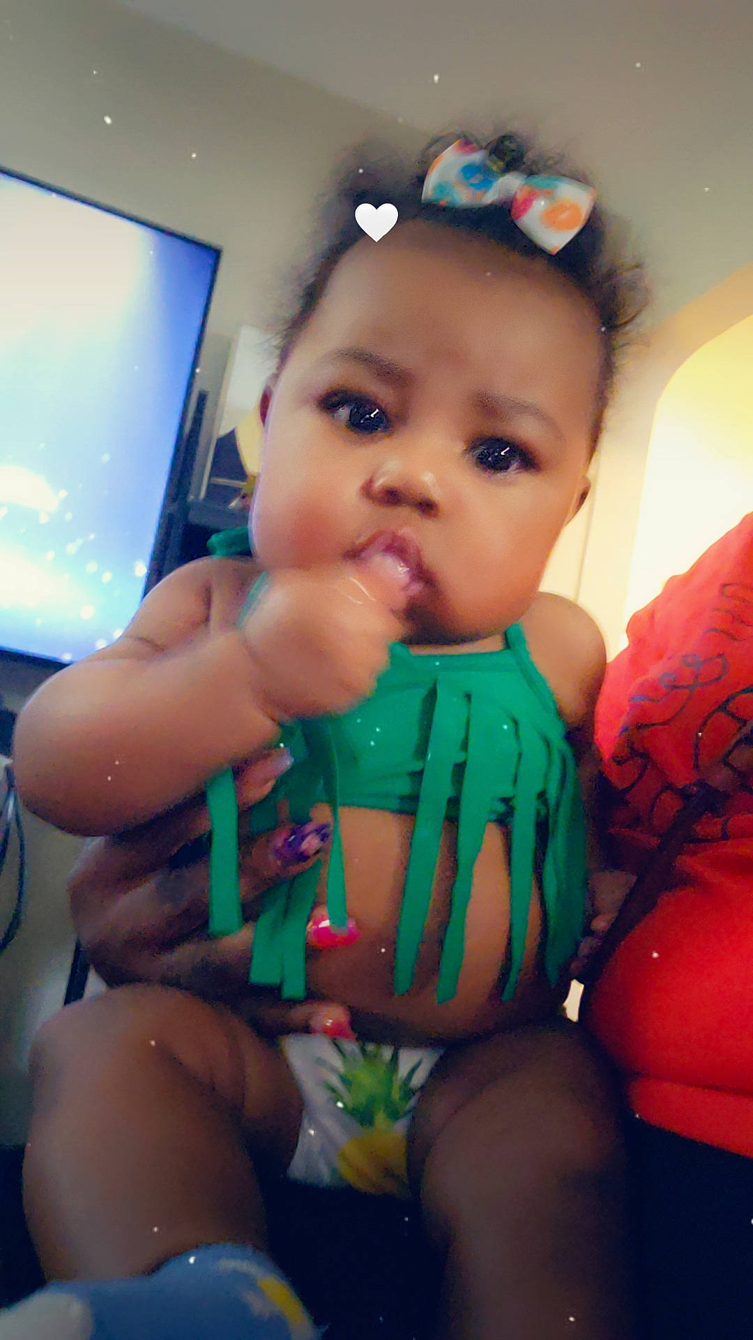 Sevyn is registered to the contest to win money with this photo: baby, baby_toddler_clothing, cheek, child, cool, electric_blue, eye, finger, fun, happy, human_body, human_leg, iris, mouth, person, skin, television, thigh, thumb, toddler