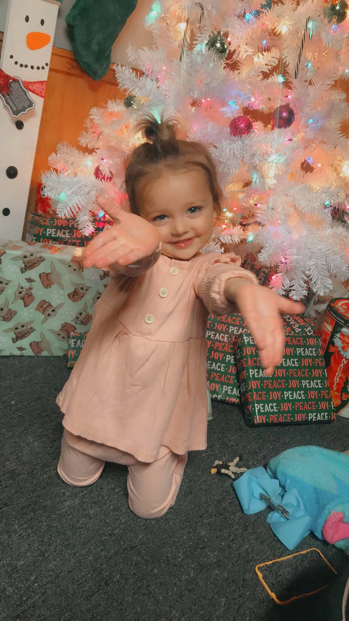 Avahlenn is registered to the contest to win money with this photo: baby_toddler_clothing, child, christmas_ornament, christmas_tree, dress, event, flooring, fun, happy, holiday, human_body, joy, ornament, pattern, person, pink, play, skin, smile, textile