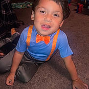 Shyloe is registered to the contest to win money with this photo: bow_tie, boy, brown_hair, carpet, casual, child, clothing, cute, expression, face, floor, hand, home, indoor, person, playful, sitting, suspenders, toy, young