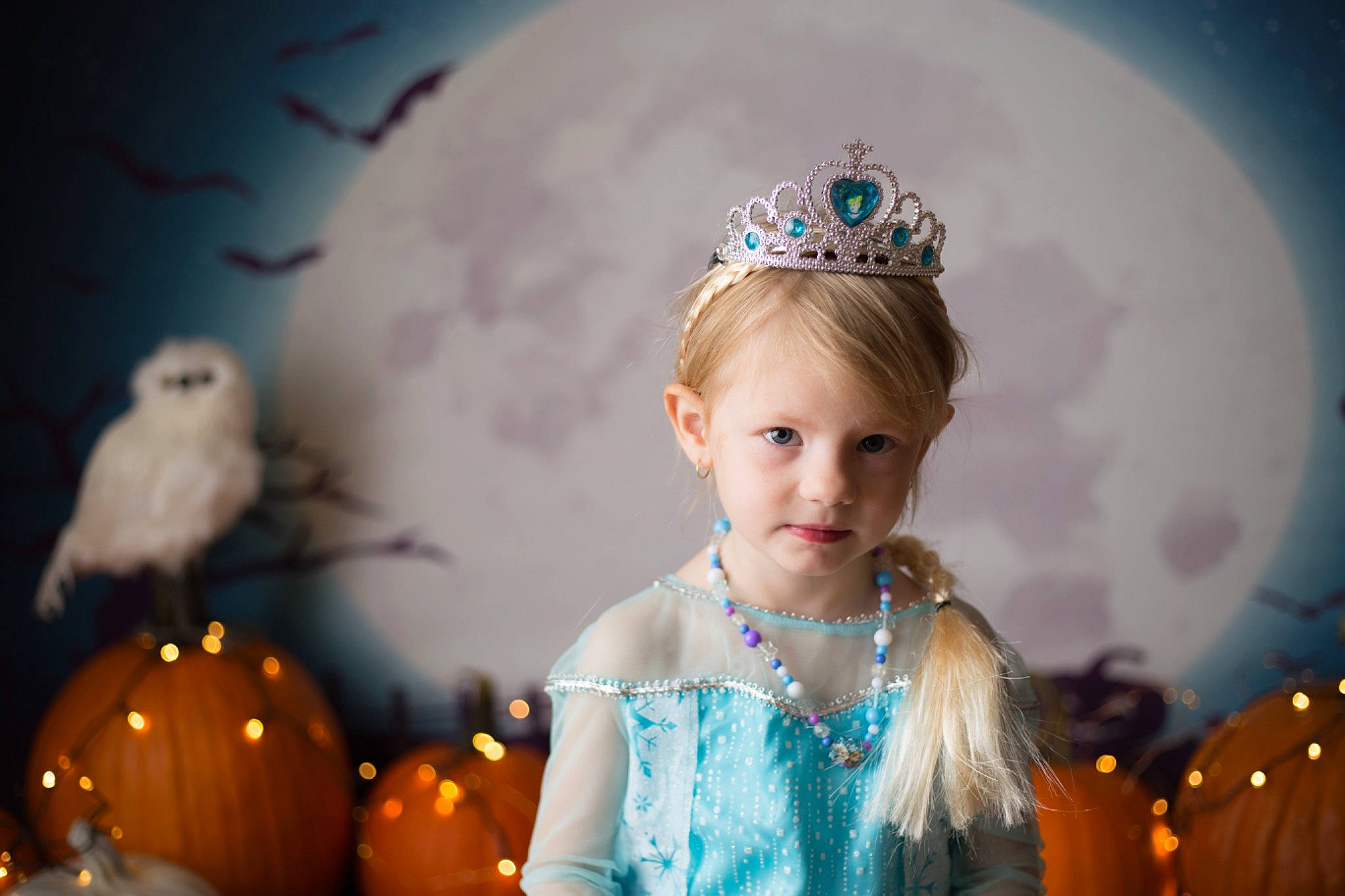 Kiera is registered to the contest to win money with this photo: beauty, child, crown, dress, eye, face, fashion_accessory, feather, hair, hair_accessory, hairstyle, head, headgear, headpiece, iris, long_hair, person, photography, portrait, tiara