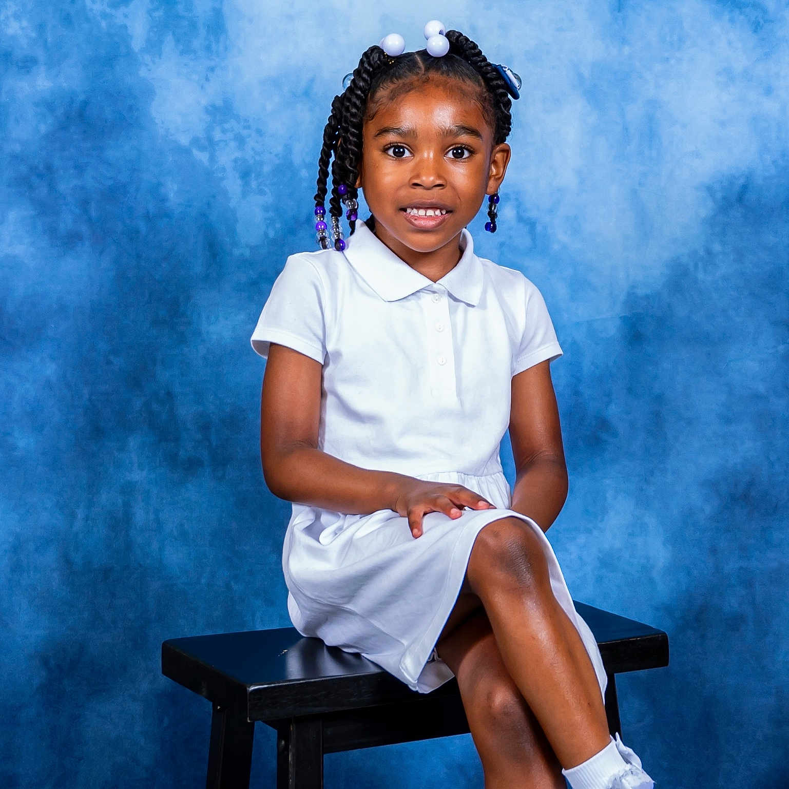 Emarose is registered to the contest to win money with this photo: bench, blackhair, child, clothing, face, female, footwear, furniture, girl, hair, happy, head, person, photography, portrait, shoe, sitting, sleeve, smile, student