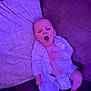 Weston is registered to the contest to win money with this photo: baby, infant, couch, pillow, diaper, clothing, yawning, hand, face, person, sitting, furniture, living_room, expression, home, relaxing, casual, indoors, portrait, young_child