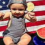 baby, child, infant, cap, overalls, watermelon, plate, american_flag, milestone, sign, sitting, cute, summer, outdoor, food, fruit, skin, feet, hands, portrait