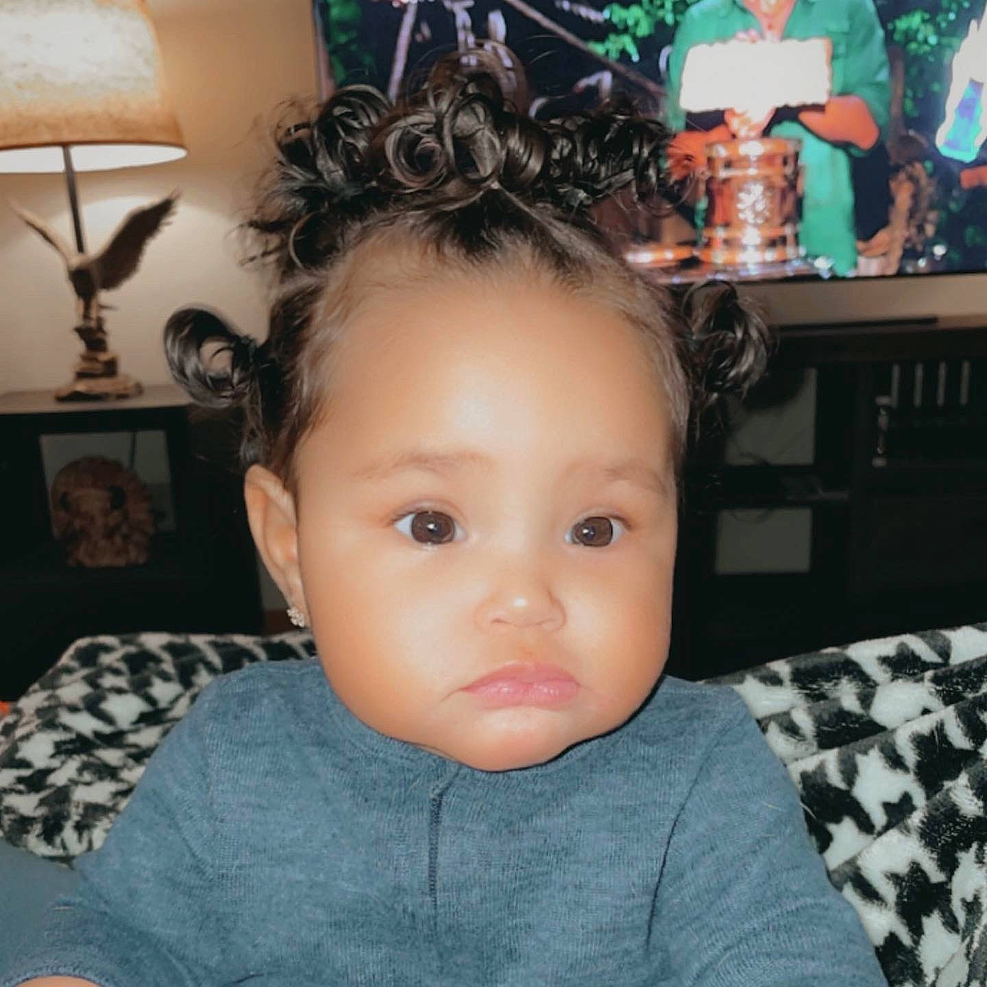 Zaylei joined the competition — help win amazing prizes! baby, baby_toddler_clothing, cheek, child, ear, eyebrow, eyelash, forehead, hair_accessory, hairstyle, head, iris, lamp, lampshade, light_fixture, lip, neck, person, picture_frame, t_shirt