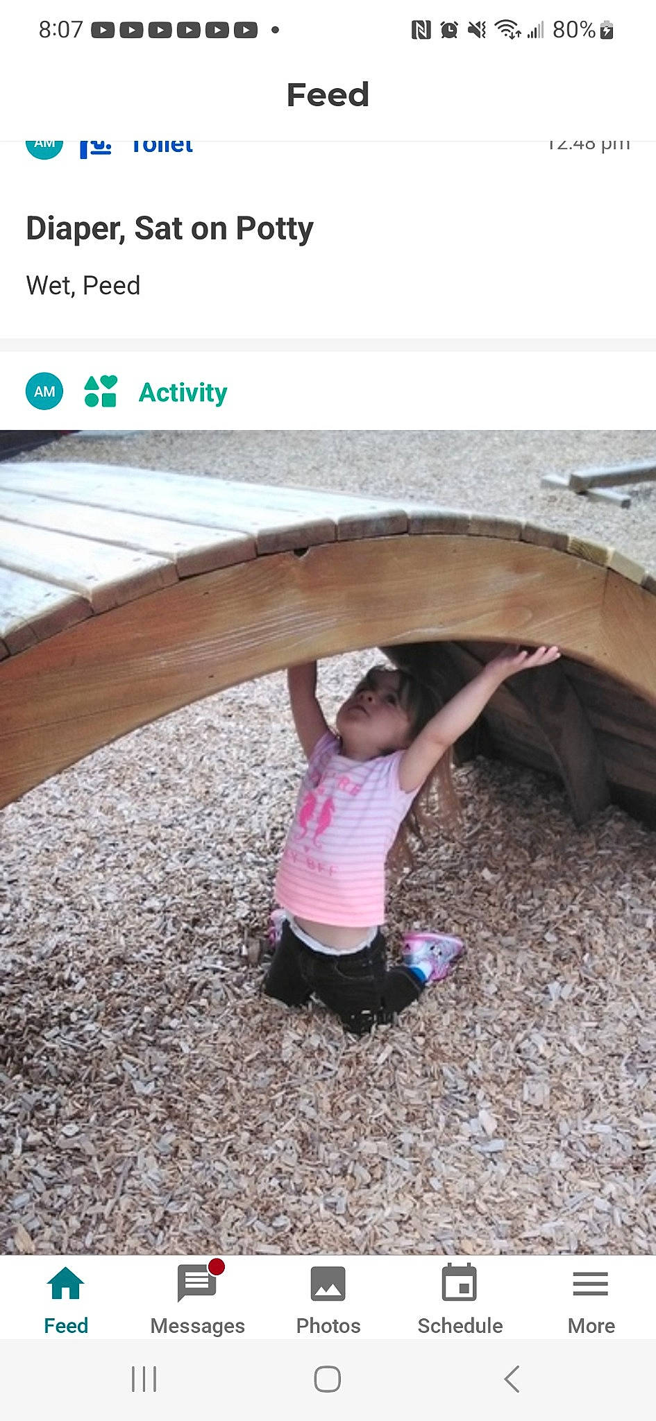 Arlyn joined the competition — help win amazing prizes! arch, asphalt, automotive_tire, automotive_wheel_system, child, font, fun, grass, landscape, leisure, magenta, person, play, recreation, rock, shorts, sitting, sleeve, soil, t_shirt