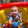 Leon joined the competition — help win amazing prizes! toddler, child, ball_pit, colorful_balls, blue_ball, inflatable, play, indoor, living_room, sofa, blanket, happy, cute, smiling, person, baby, fun, toy, playtime, home