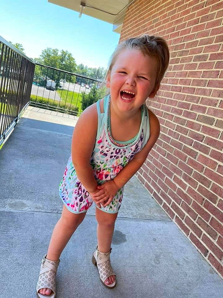 Alison is registered to the contest to win money with this photo: asphalt, brick, brickwork, electric_blue, finger, fun, grass, happy, knee, leg, leisure, person, recreation, road_surface, sky, smile, street_fashion, t_shirt, thigh, toddler