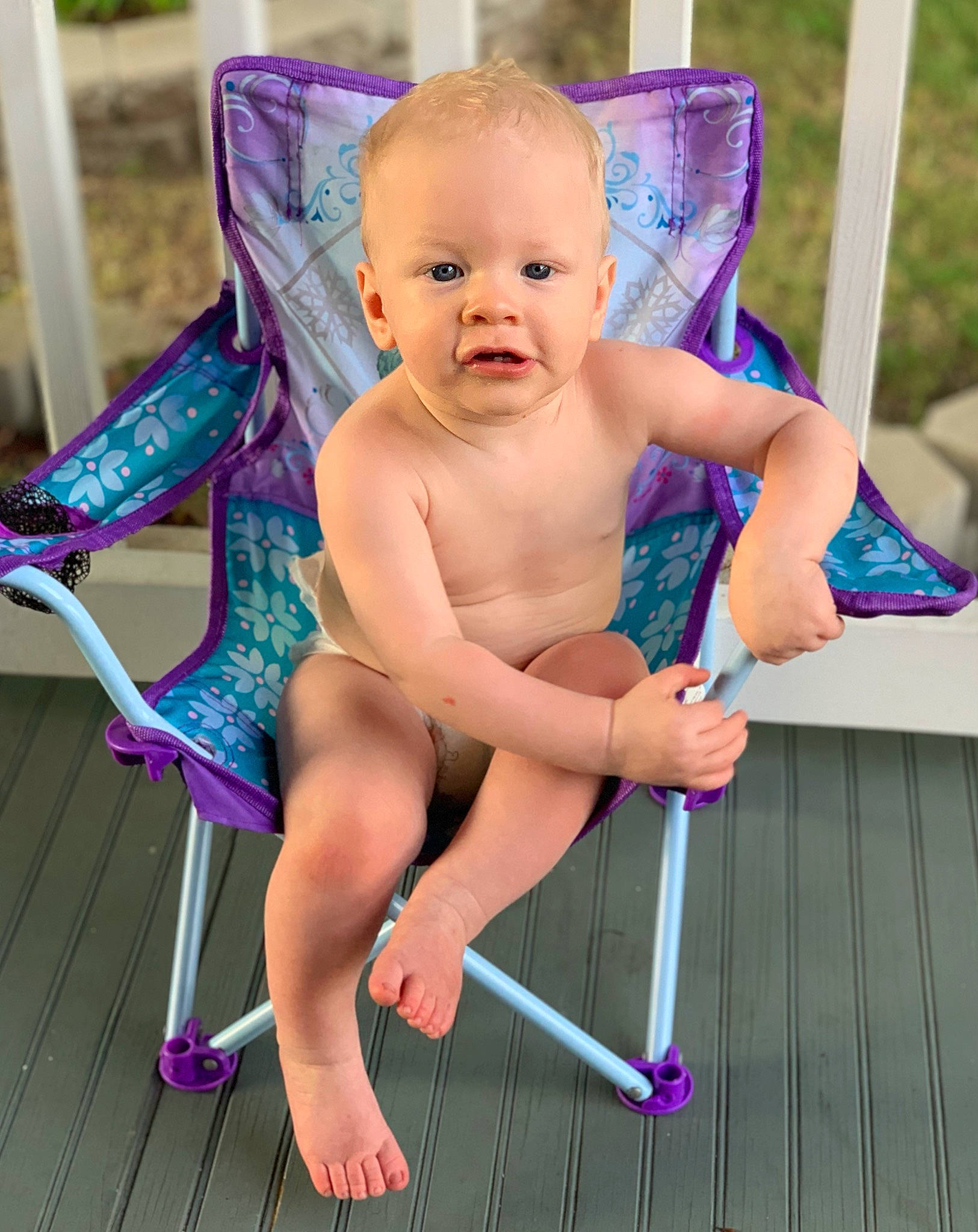 Evan is registered to the contest to win money with this photo: baby, chair, child, folding_chair, furniture, leg, leisure, person, product, sitting, smile, toddler