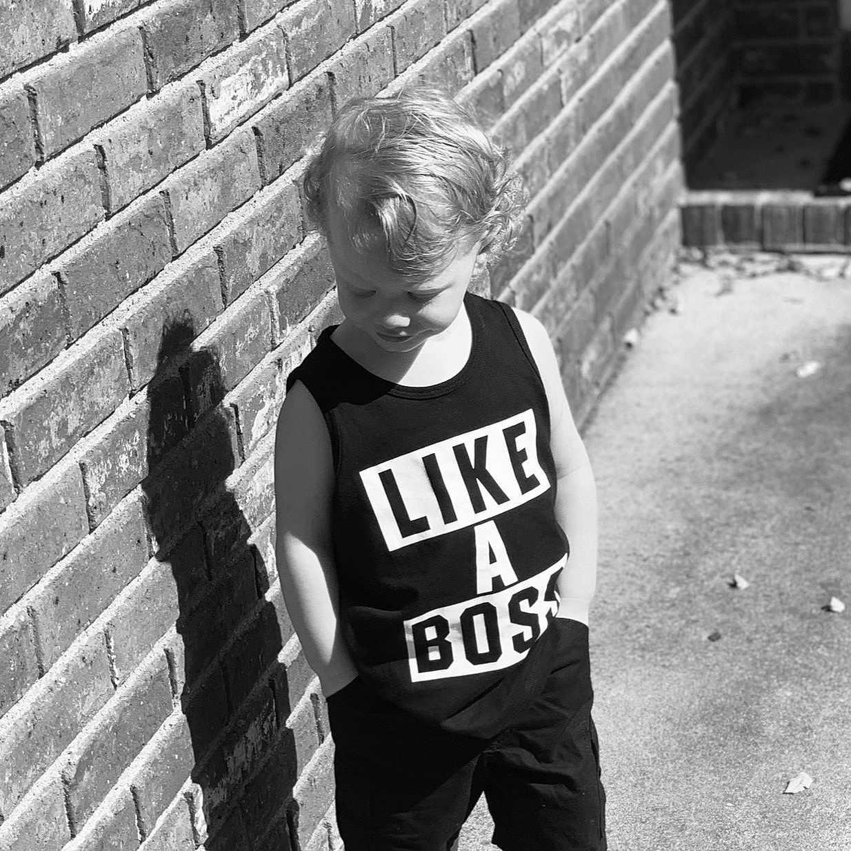 Elijah joined the competition — help win amazing prizes! black, black_and_white, brick, child, cool, male, monochrome, monochrome_photography, photograph, photography, shoe, smile, snapshot, standing, stock_photography, style, t_shirt, toddler, wall, white