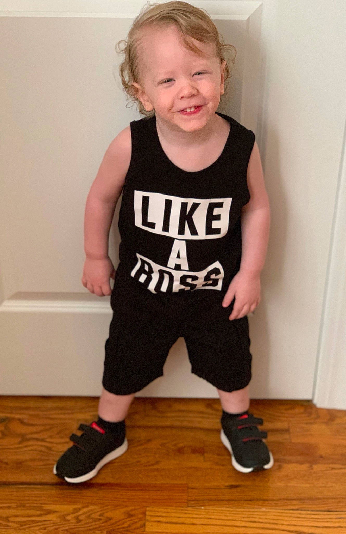 Elijah is registered to the contest to win money with this photo: baby_toddler_clothing, child, clothing, footwear, joy, knee, male, outerwear, person, product, shoe, shorts, shoulder, sleeve, sleeveless_shirt, sportswear, standing, t_shirt, toddler