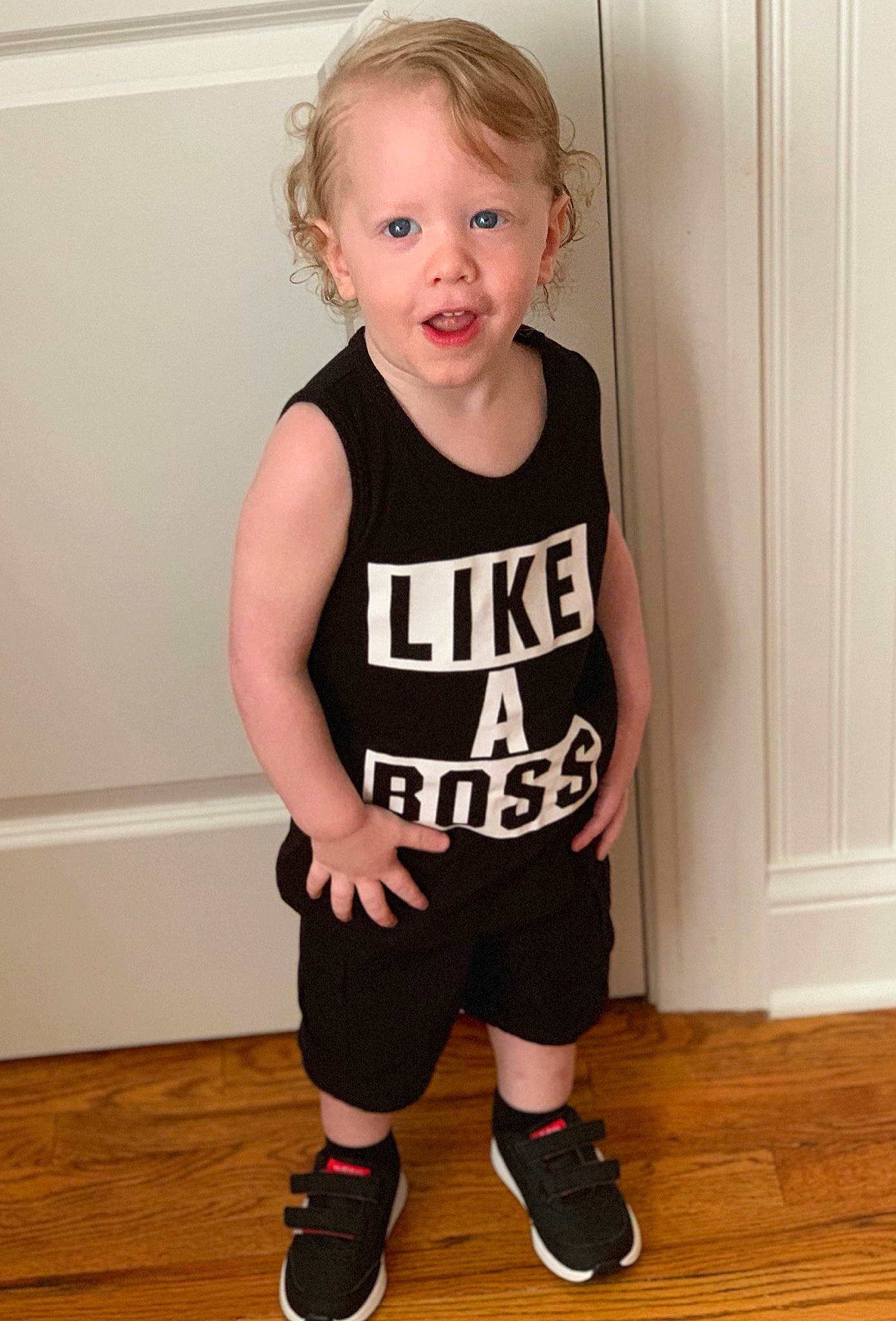 Elijah is registered to the contest to win money with this photo: baby_toddler_clothing, black, child, child_model, clothing, footwear, knee, outerwear, person, product, shoe, shorts, shoulder, sleeve, sleeveless_shirt, sportswear, standing, t_shirt, toddler