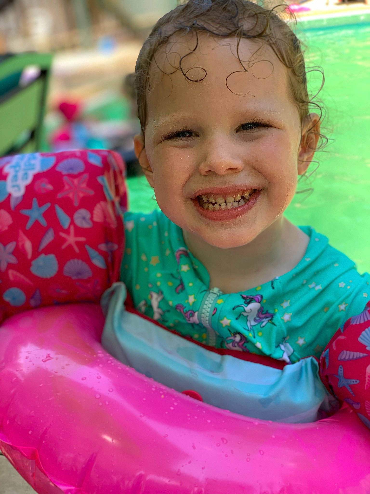 Kori is registered to the contest to win money with this photo: child, fun, happy, inflatable, joy, leisure, person, play, recreation, sitting, smile, toddler