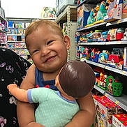 Catalella Ortiz joined the competition — help win amazing prizes! baby, ball, face, food, football, happy, head, indoors, person, photography, portrait, shelf, shop, shopping, smile, soccer, soccerball, sport, sweets, toy