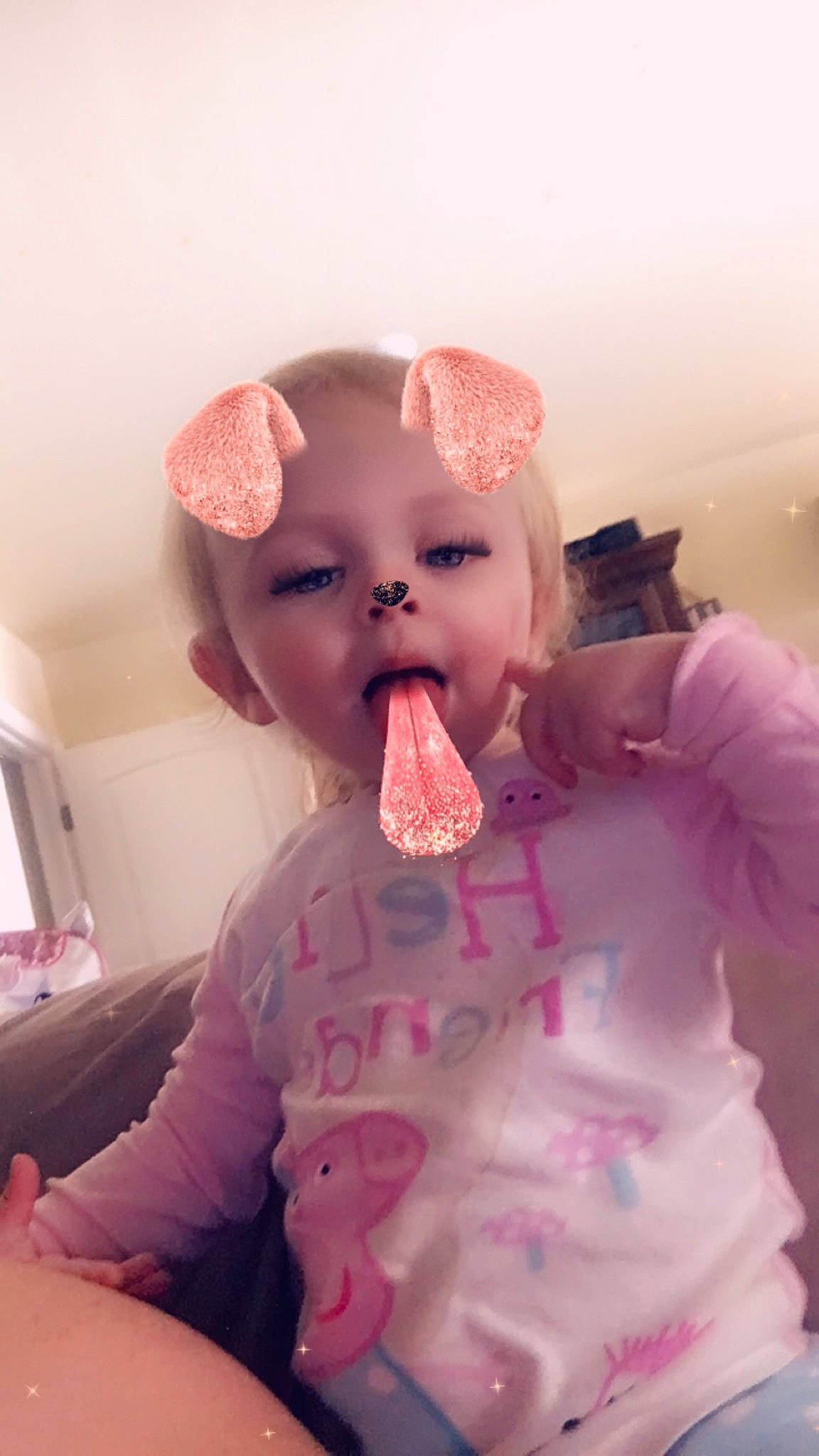Emmalyn is registered to the contest to win money with this photo: baby, cheek, child, ear, headwear, lip, mouth, neck, nose, person, pink, toddler, tongue