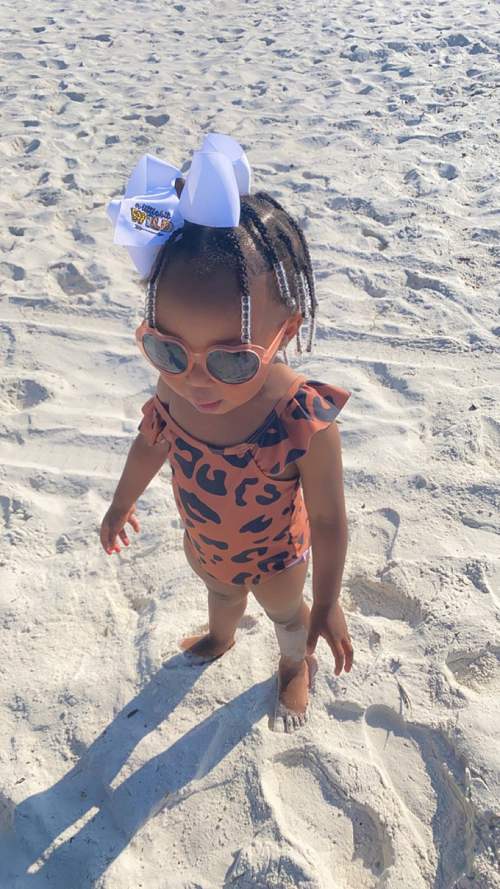 Karleigh is registered to the contest to win money with this photo: baby, baby_toddler_clothing, baseball_cap, beach, body_of_water, cap, clothing, eyewear, fun, goggles, happy, hat, headgear, people_in_nature, people_on_beach, person, sun_hat, sunglasses, sunlight, t_shirt