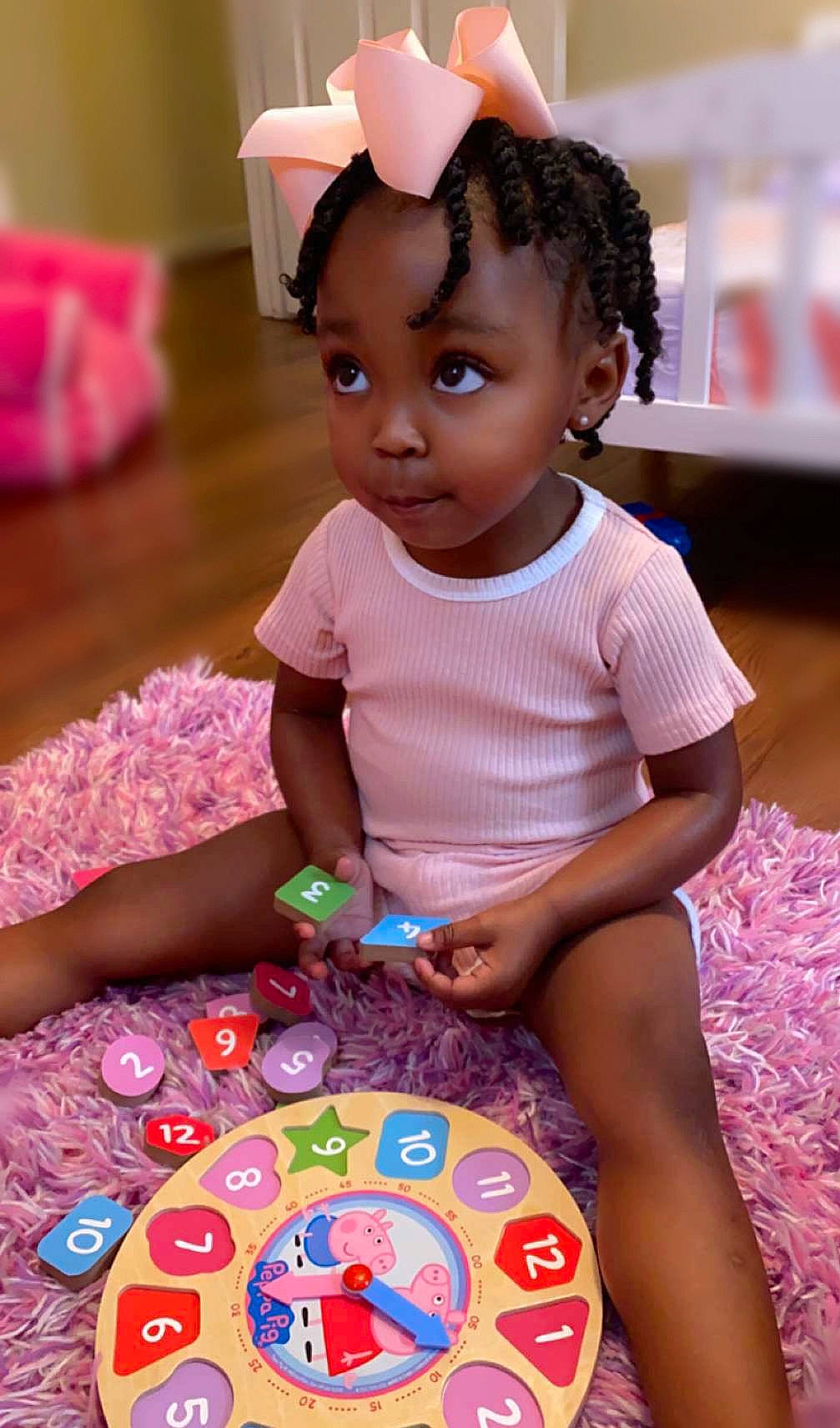 Karleigh is registered to the contest to win money with this photo: adaptation, baby, baby_toddler_clothing, cheek, child, event, fun, hairstyle, happy, leisure, magenta, person, pink, play, purple, sharing, sitting, skin, sweetness, toddler