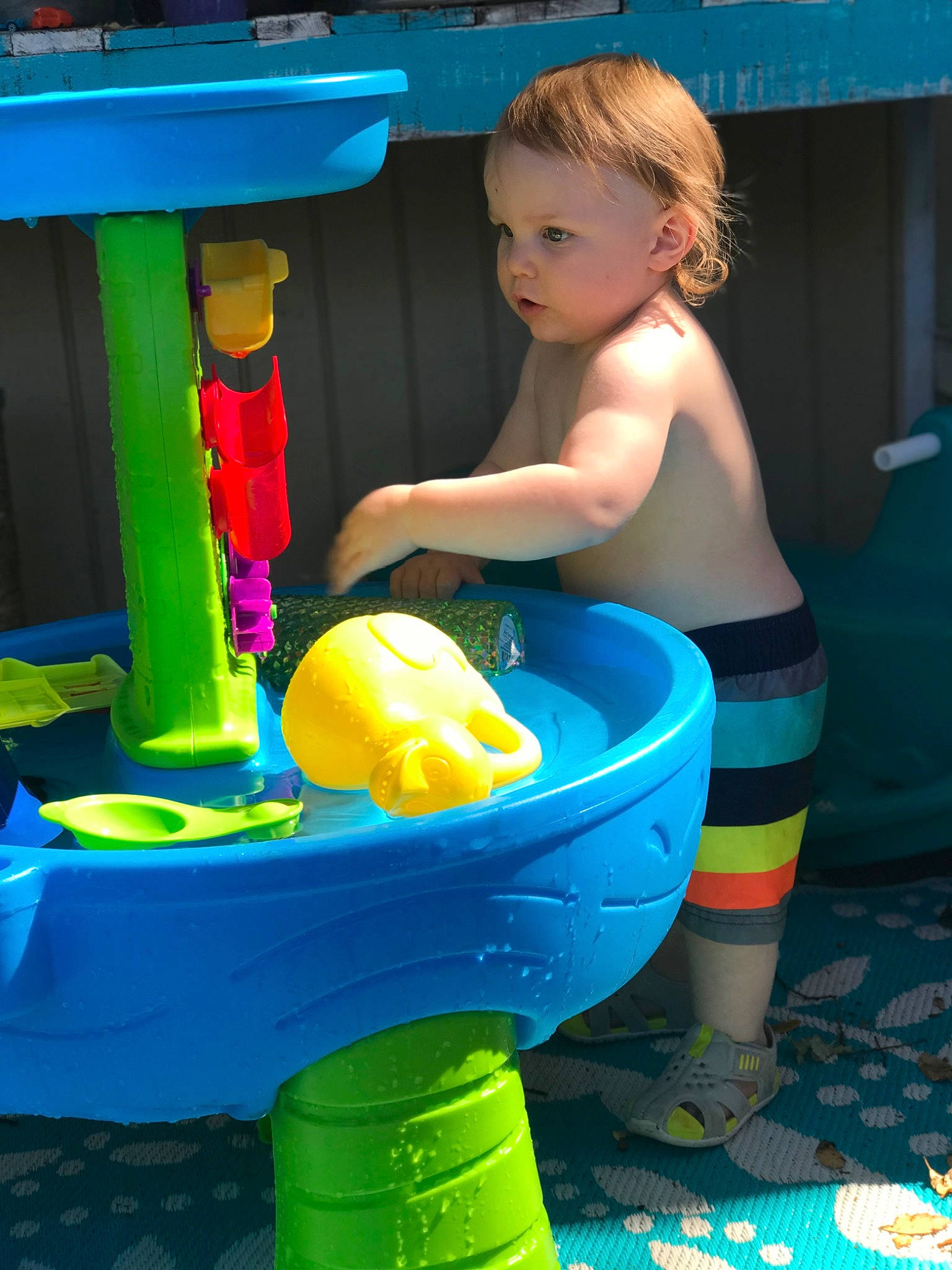 Derek is registered to the contest to win money with this photo: baby_products, bathing, blue, boats_and_boating_equipment_and_supplies, bucket, child, electric_blue, fun, games, household_supply, inflatable, leisure, person, plastic, play, recreation, sitting, toddler, toy, vacation
