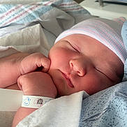 Braxton joined the competition — help win amazing prizes! newborn, baby, sleeping, hat, hospital, blanket, wristband, infant, closeup, face, skin, hand, peaceful, cute, resting, soft, indoors, person, child, portrait