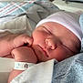newborn, baby, sleeping, hat, hospital, blanket, wristband, infant, closeup, face, skin, hand, peaceful, cute, resting, soft, indoors, person, child, portrait