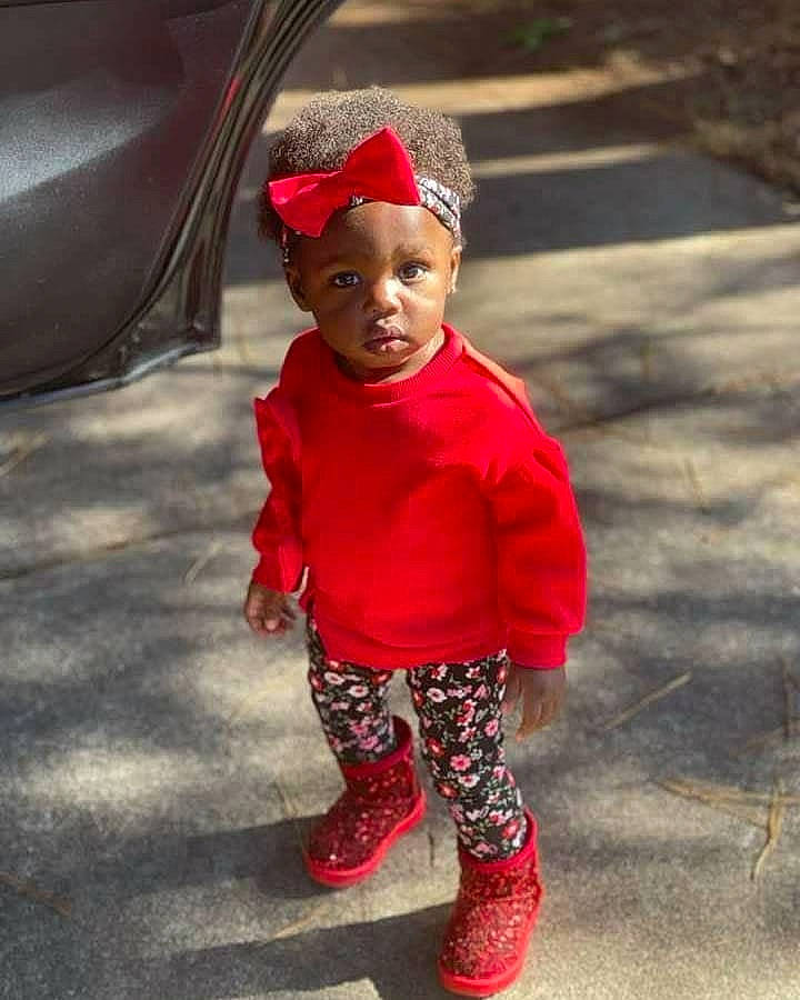 Blessings joined the competition — help win amazing prizes! baby, baby_toddler_clothing, cap, cool, face, grass, hairstyle, happy, head, headwear, human_body, human_leg, leg, lip, magenta, outerwear, person, recreation, red, sleeve