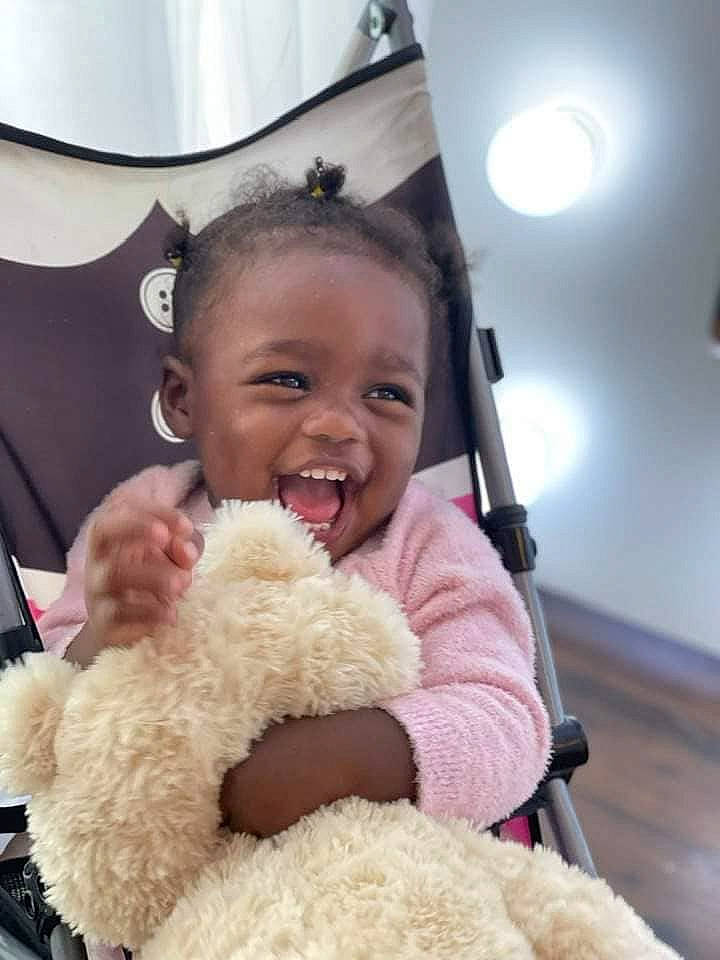 Blessings is registered to the contest to win money with this photo: baby, baby_toddler_clothing, cheek, child, comfort, finger, fun, fur, glasses, happy, head, nose, person, skin, smile, stuffed_toy, sunglasses, teddy_bear, toddler, toy