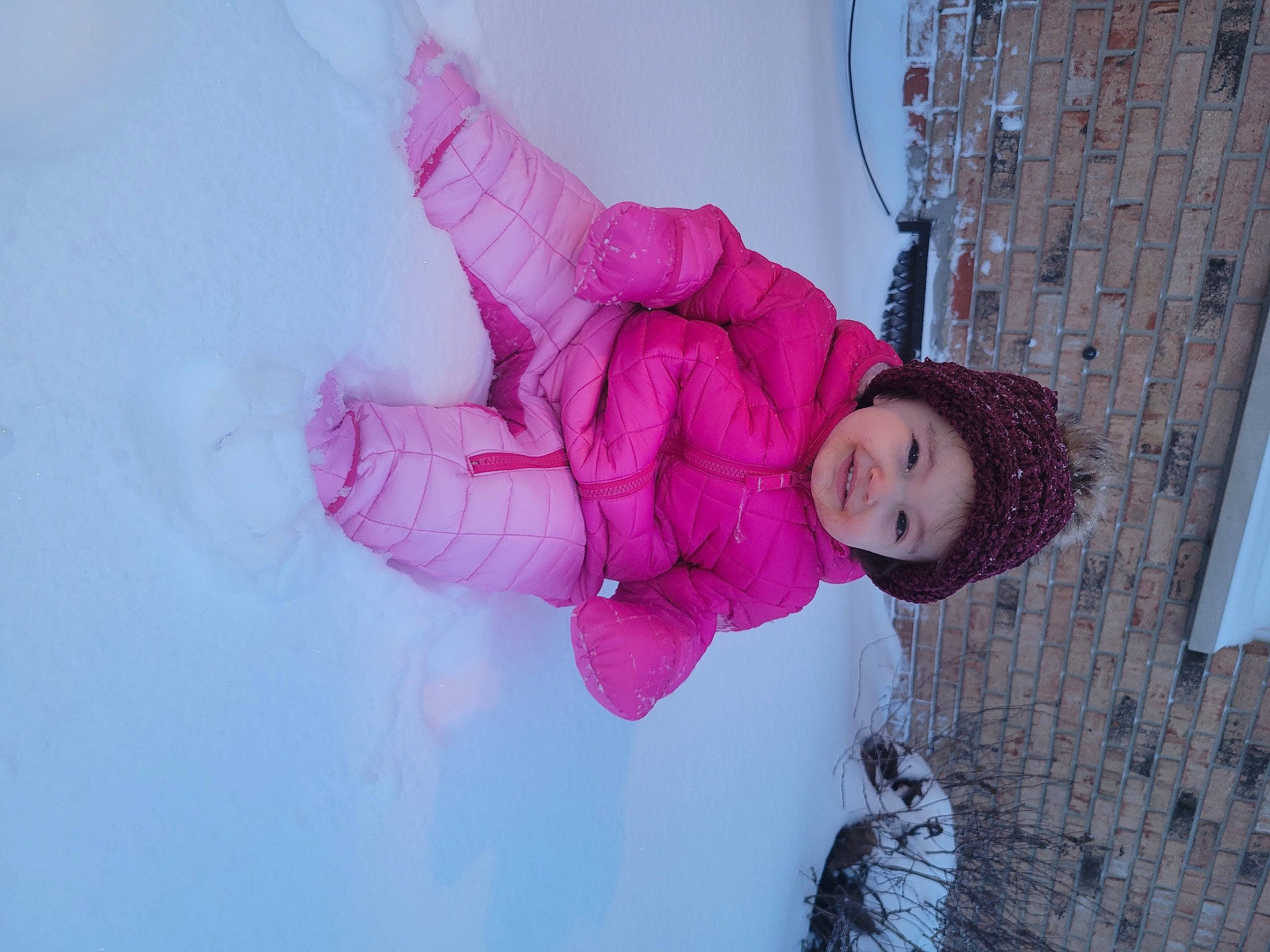 Magnolia joined the competition — help win amazing prizes! baby, baby_toddler_clothing, cheek, child, freezing, fun, glove, happy, headwear, jacket, magenta, person, pink, playing_in_the_snow, purple, smile, snow, toddler, window, winter