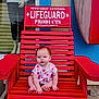 adult, baby, chair, clothing, dress, face, female, furniture, glove, head, person, photography, plant, portrait, pottedplant, rockingchair, sitting, t_shirt, woman, wood