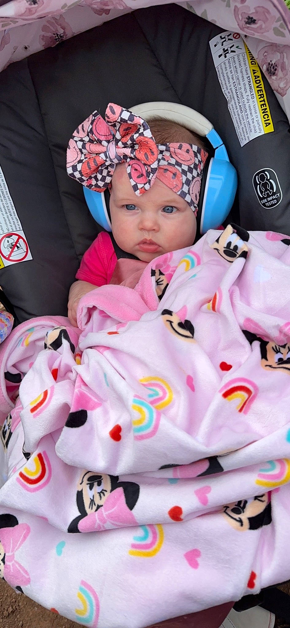 Caitlin is registered to the contest to win money with this photo: baby, baby_carriage, baby_products, baby_sleeping, baby_toddler_clothing, cap, car_seat, cheek, child, fashion_accessory, fun, happy, headwear, linens, magenta, pattern, person, personal_protective_equipment, pink, sleeve