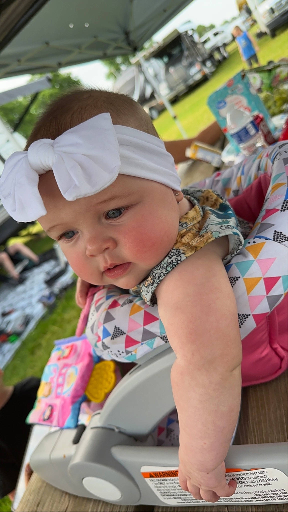Caitlin joined the competition — help win amazing prizes! baby, baby_products, child, event, fashion_accessory, fun, happy, hat, headgear, headwear, human_leg, leisure, person, pink, public_space, recreation, sitting, skin, summer, sun_hat