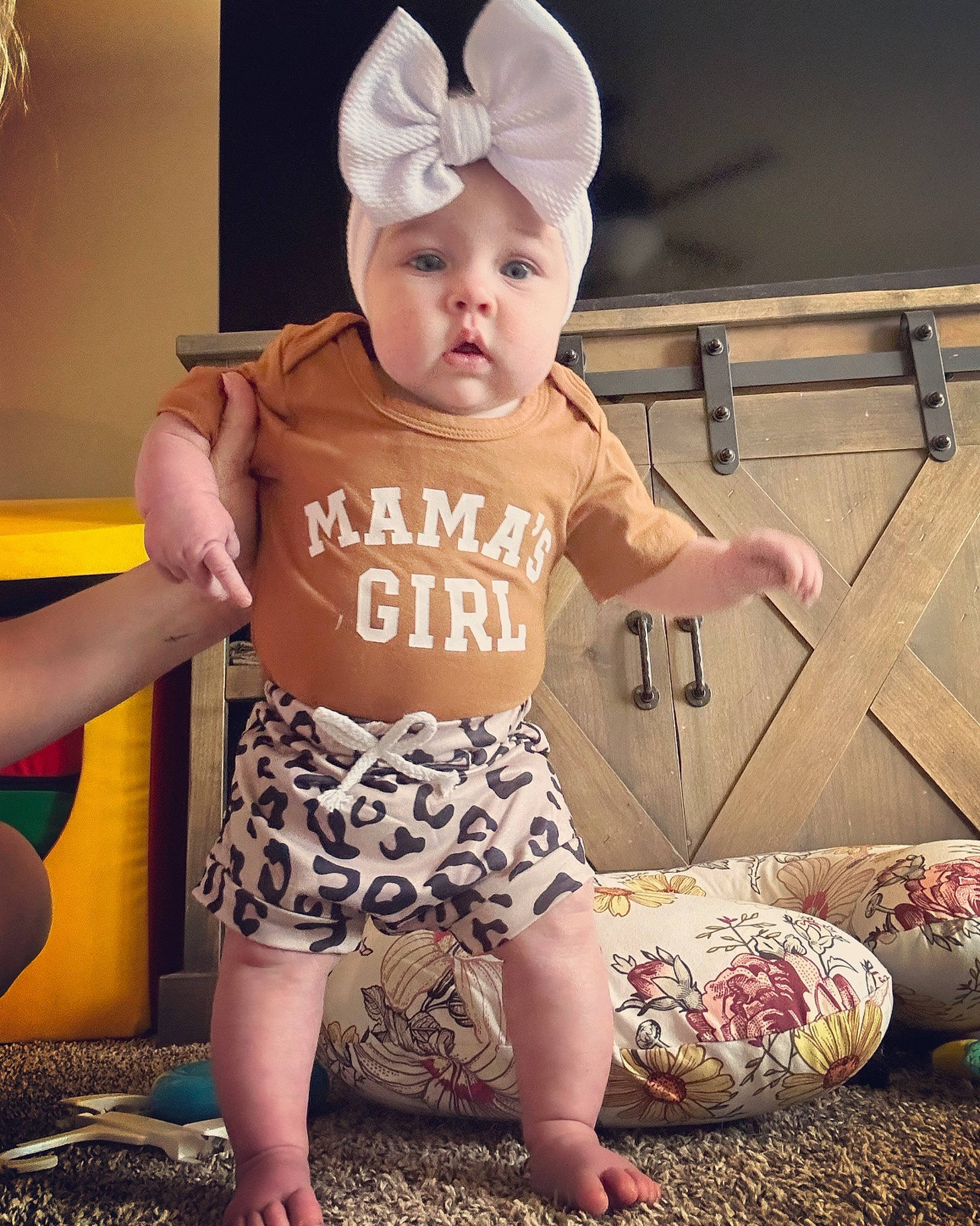 Caitlin is registered to the contest to win money with this photo: baby, baby_toddler_clothing, cap, child, cool, costume_hat, finger, fun, happy, hat, headgear, headwear, human_body, human_leg, pattern, person, pink, skin, sleeve, t_shirt