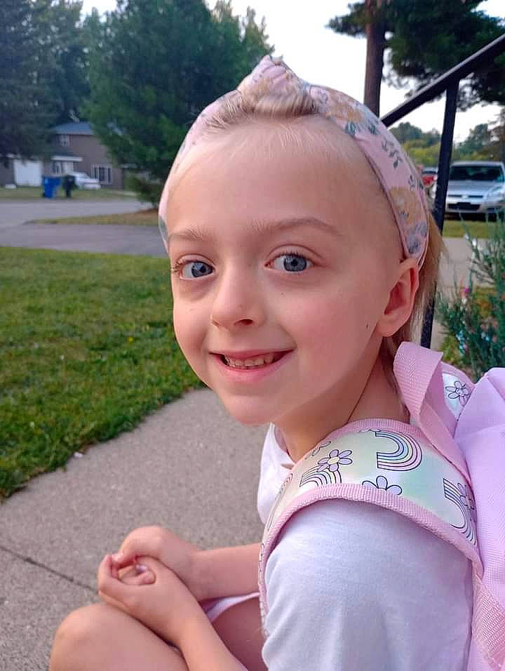 Angel is registered to the contest to win money with this photo: blond, child, chin, fun, gesture, grass, hairstyle, happy, jewellery, joy, leisure, lip, person, pink, plant, recreation, skin, sky, smile, thumb