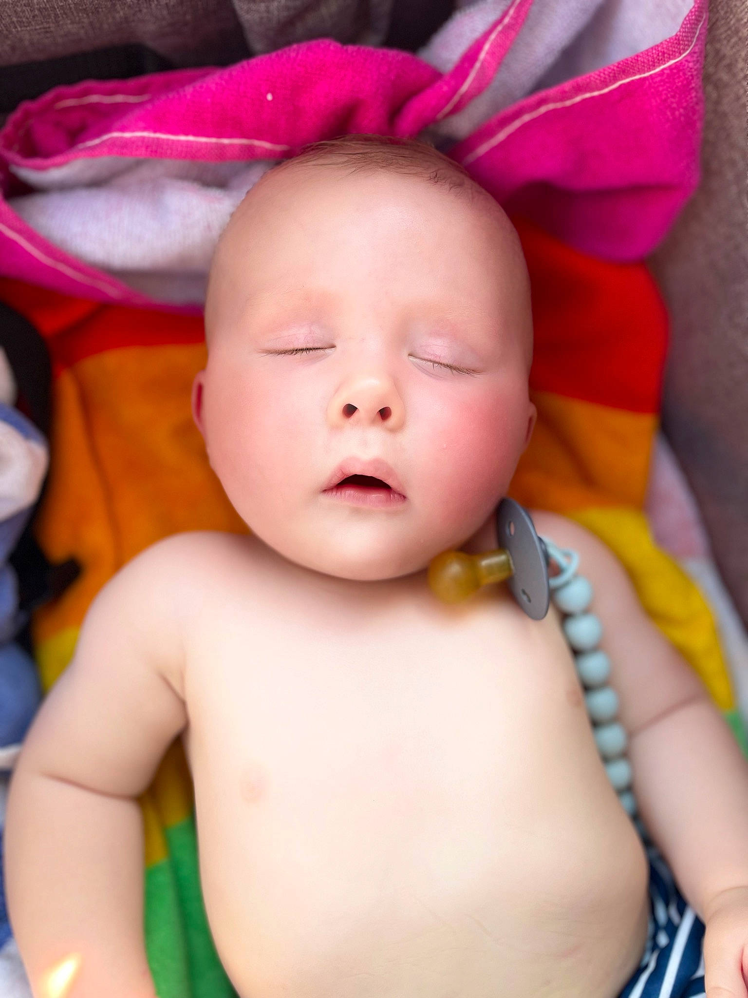 Easton is registered to the contest to win money with this photo: baby, baby_toddler_clothing, cheek, child, chin, close_up, comfort, eyelash, finger, fun, green, happy, human_body, lip, magenta, neck, person, pink, skin, toddler